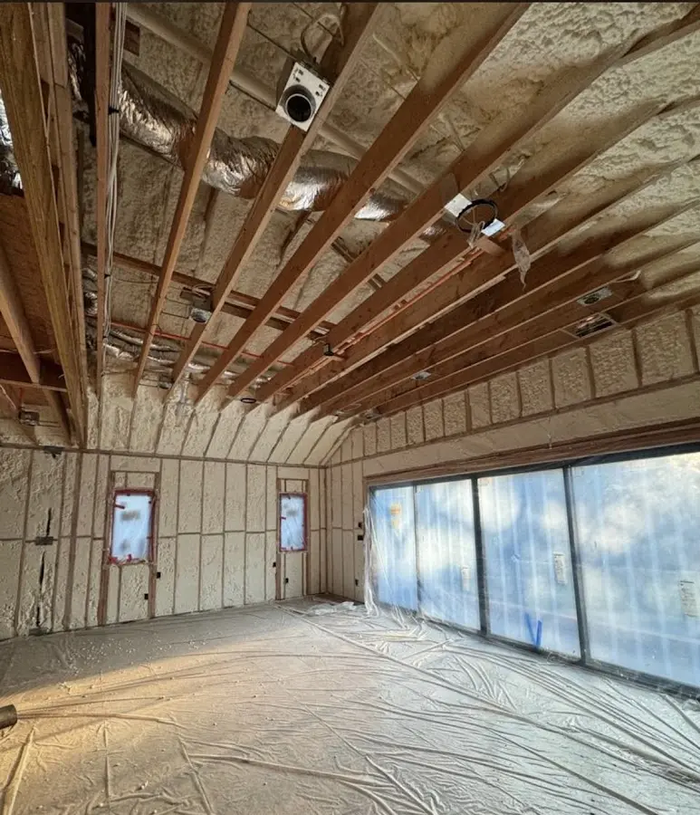 Interior walls and ceiling insulated with spray foam during new construction in Commerce